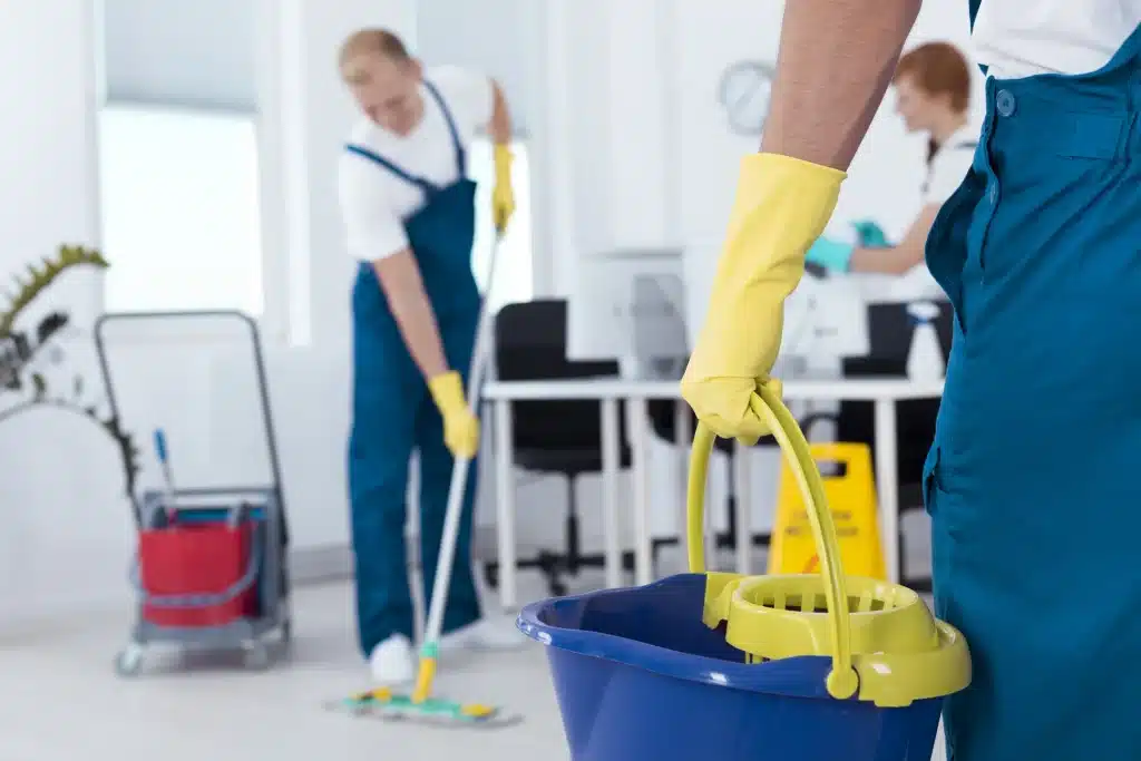 A professional cleaning team member from Calgary Cleaning inspecting a commercial space during a routine quality check, ensuring consistent cleanliness standards.